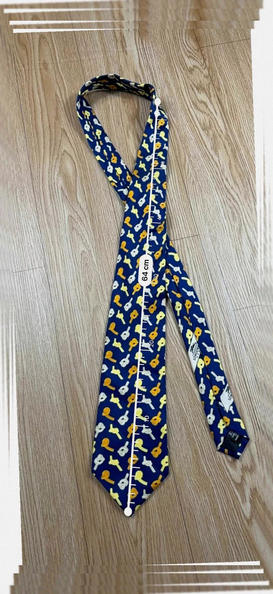 Cravate Longchamp soie bleu marine motifs guitares vintage